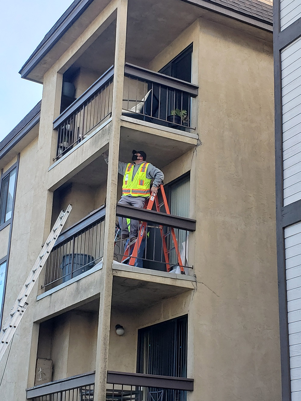 PIW inspector performing SB721 deck inspections at a California apartment complex